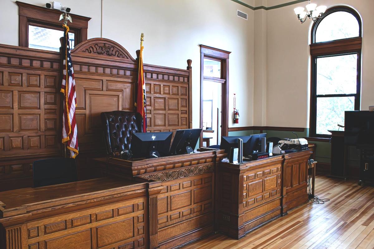 a courtroom with wooden paneling